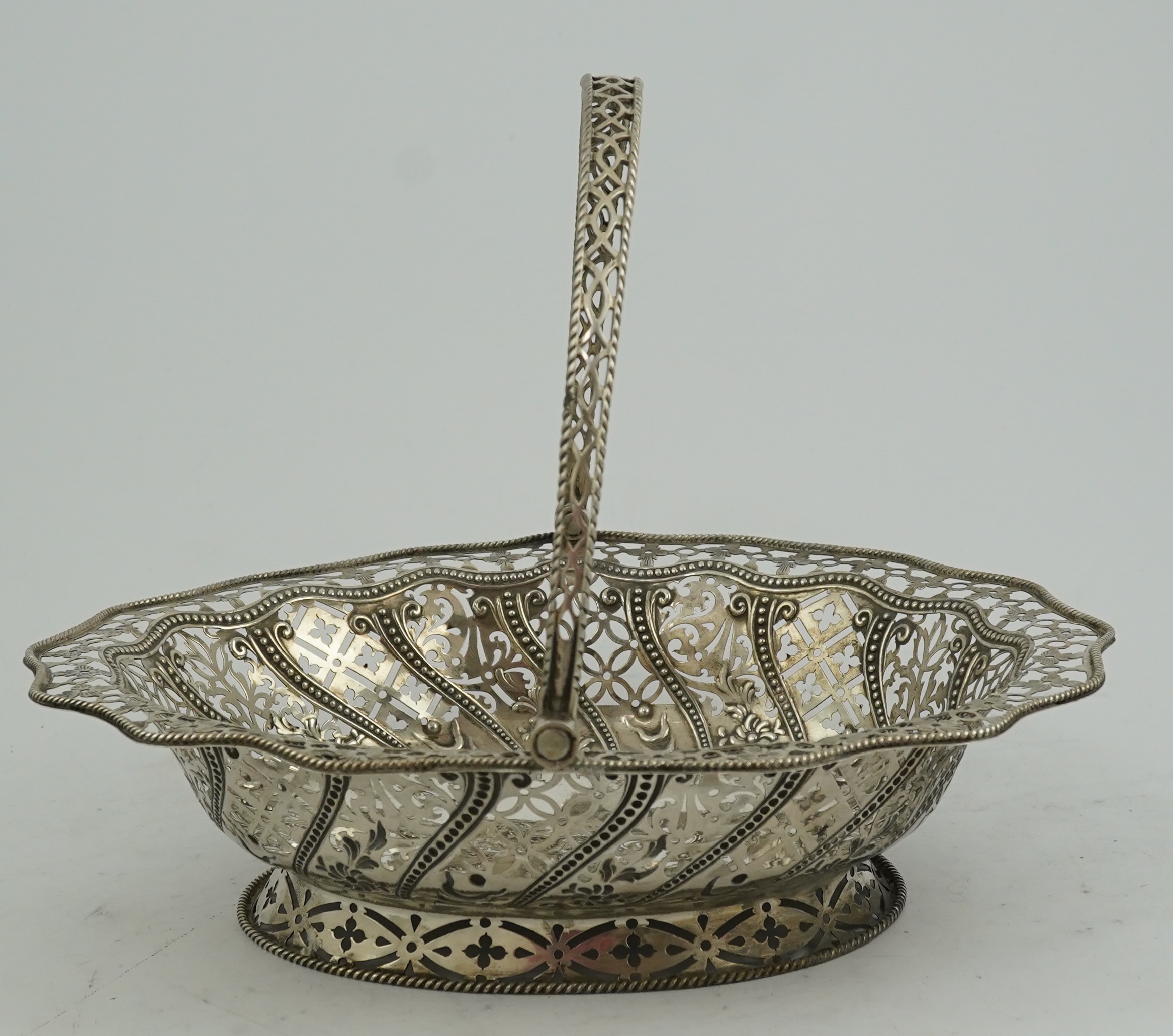 A George III pierced repousse silver cake basket